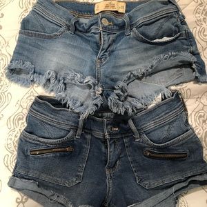TWO PAIRS OF HOLLISTER DENIM SHORTS